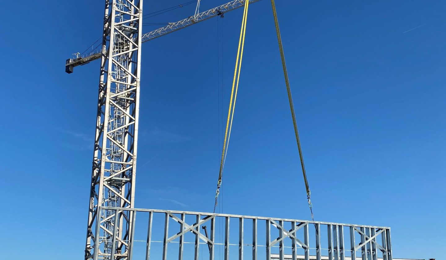 crane installing wall